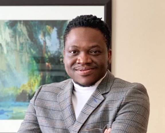 David Abolarin wearing a checked blazer
